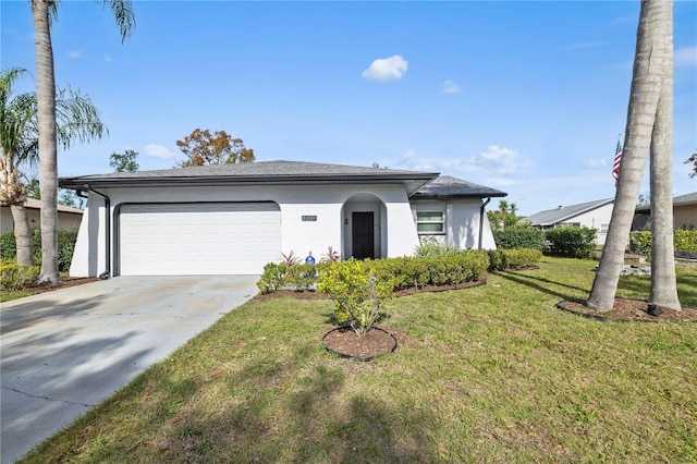 view of front of home featuring a front lawn and a garage