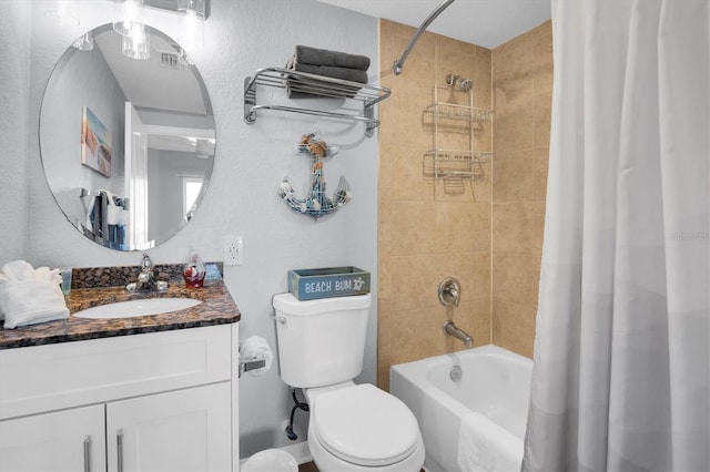 full bathroom featuring shower / bath combination with curtain, vanity, and toilet