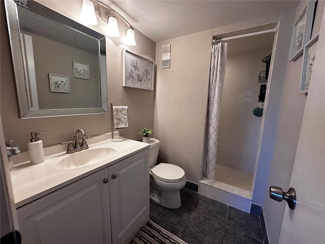 bathroom with a shower with shower curtain, tile patterned floors, vanity, and toilet