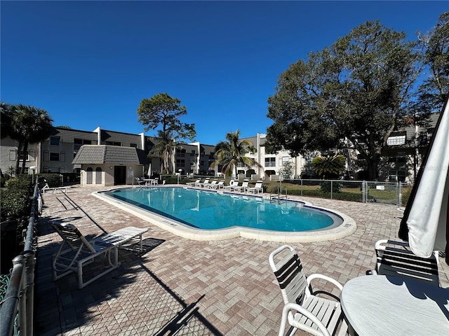 view of swimming pool with a patio