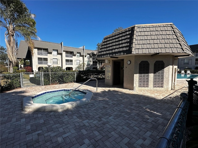 view of pool featuring a hot tub