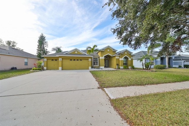 view of front of property with an attached garage, stucco siding, driveway, and a front yard