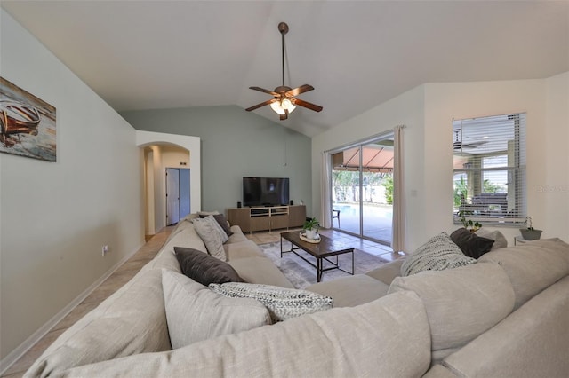 living room with ceiling fan and lofted ceiling