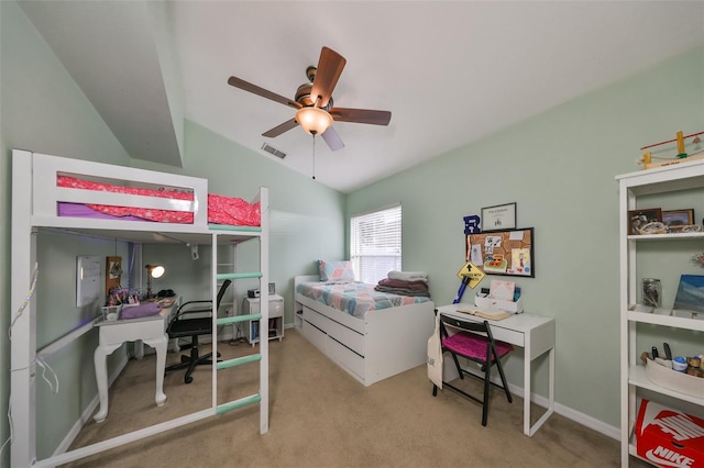 bedroom featuring light colored carpet, vaulted ceiling, and ceiling fan