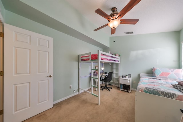 carpeted bedroom with ceiling fan