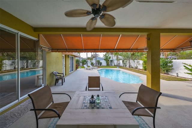 view of pool featuring ceiling fan and a patio area