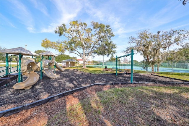 view of play area featuring tennis court