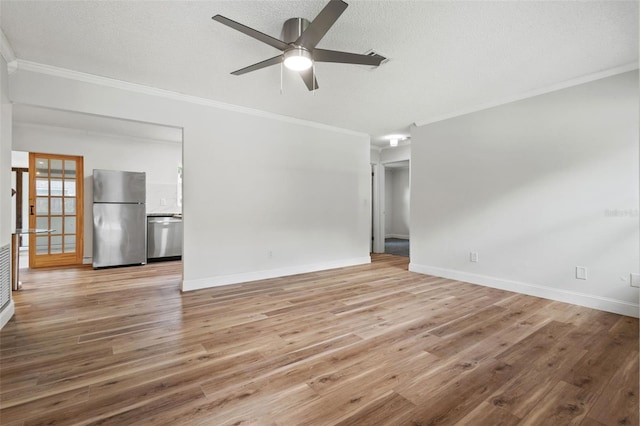 unfurnished living room featuring a textured ceiling, ornamental molding, and light wood-style flooring