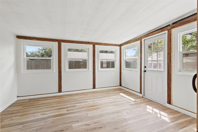 unfurnished sunroom with wooden ceiling