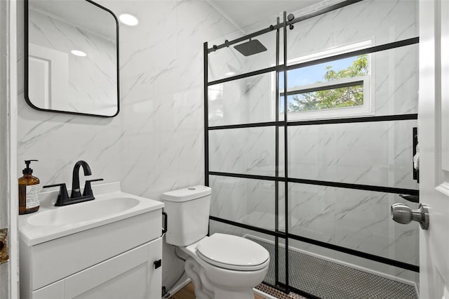 full bath with toilet, a walk in shower, tile walls, and vanity