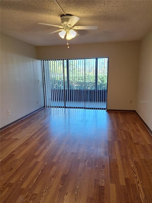 unfurnished room with ceiling fan, hardwood / wood-style floors, and a textured ceiling