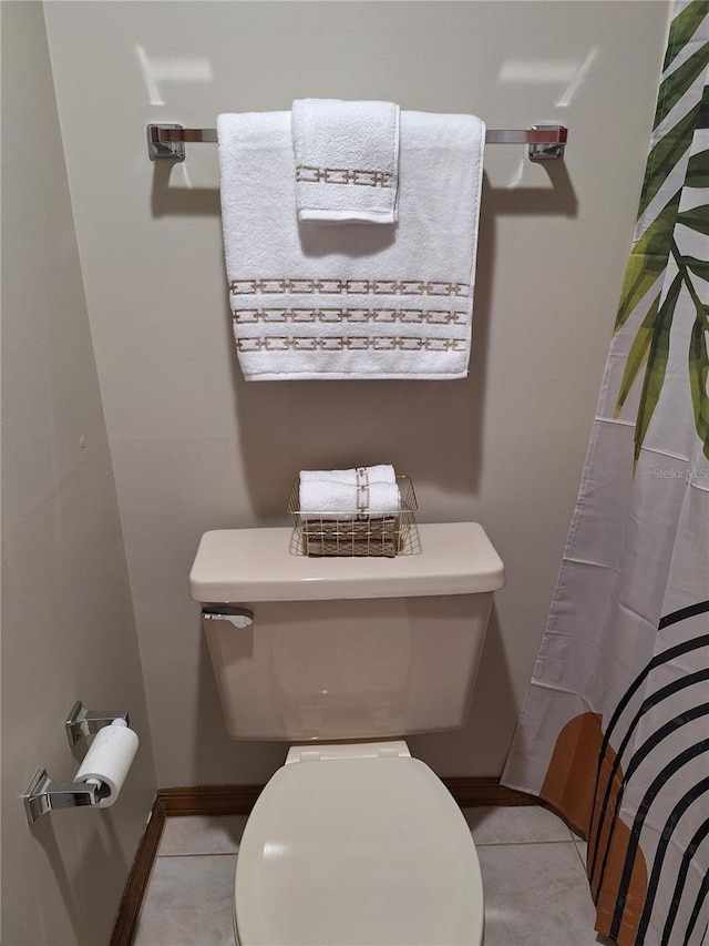 bathroom featuring tile patterned flooring and toilet