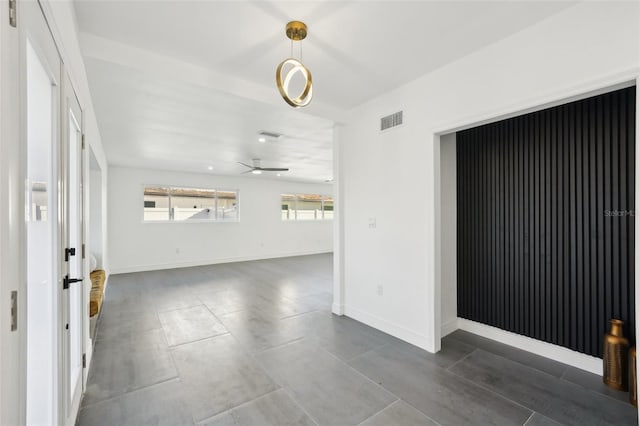 unfurnished room featuring ceiling fan