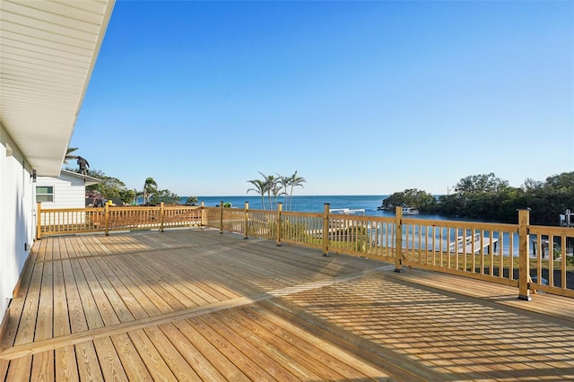 wooden deck with a water view