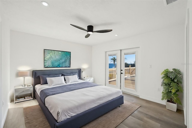 bedroom featuring light wood-type flooring, access to outside, ceiling fan, and french doors