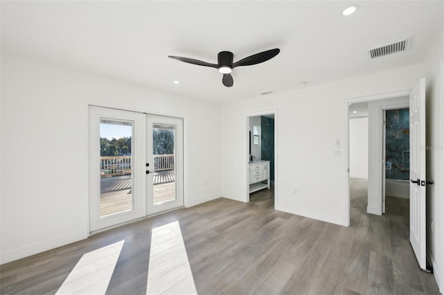 unfurnished room featuring light hardwood / wood-style flooring, ceiling fan, and french doors