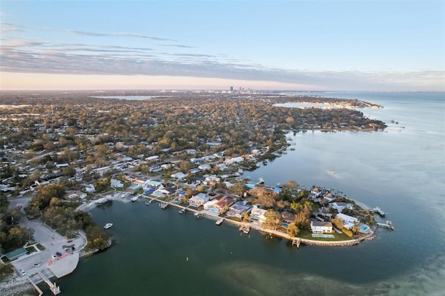 aerial view at dusk with a water view