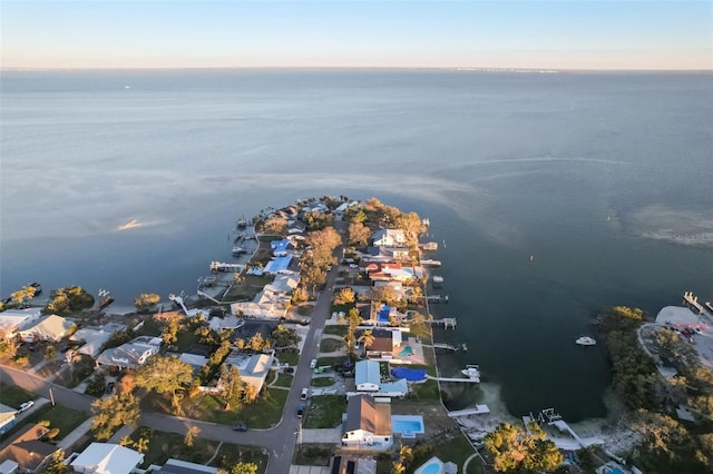 aerial view at dusk with a water view