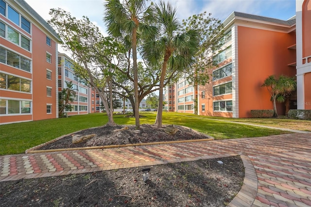 view of home's community with a yard