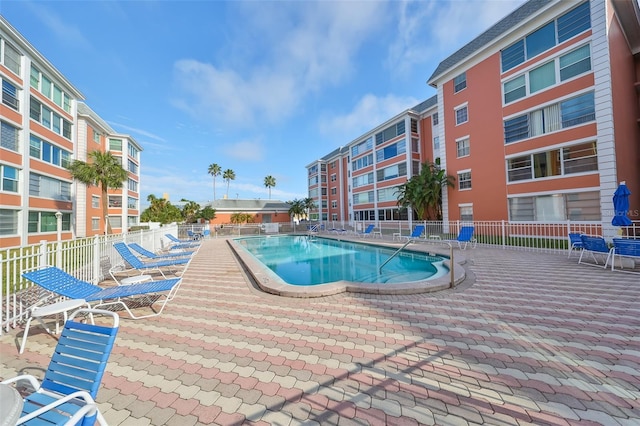 pool featuring a patio and fence