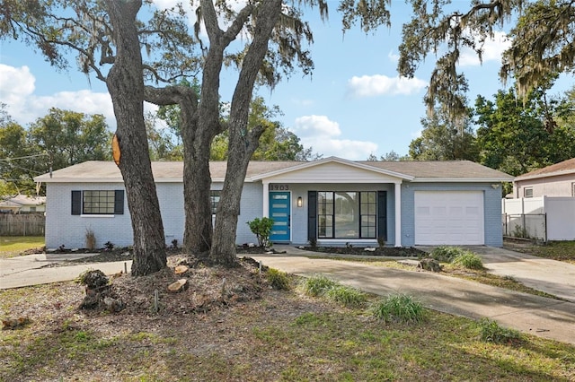 ranch-style house featuring a garage