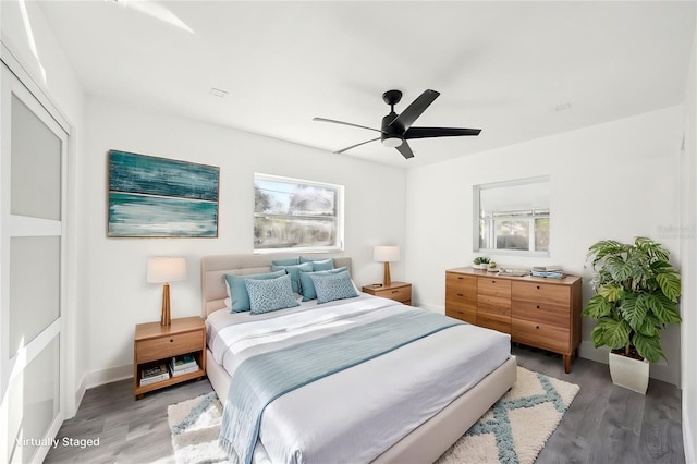 bedroom with ceiling fan and hardwood / wood-style floors