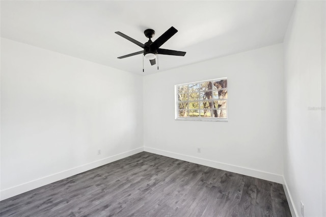 unfurnished room with dark hardwood / wood-style floors and ceiling fan