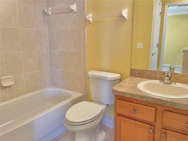 full bathroom with tiled shower / bath, tile patterned flooring, vanity, and toilet