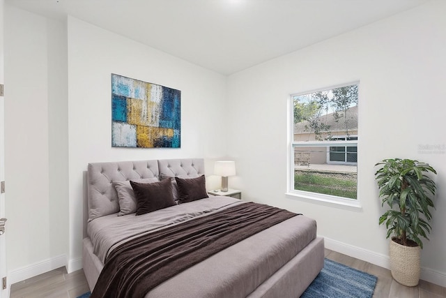 bedroom with light wood-type flooring