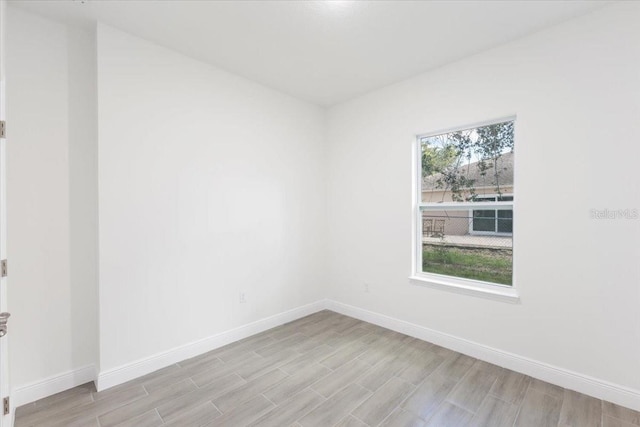 empty room with light hardwood / wood-style floors