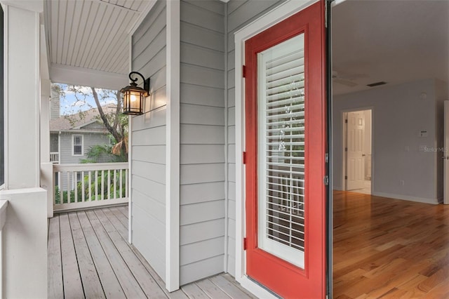 property entrance featuring a porch