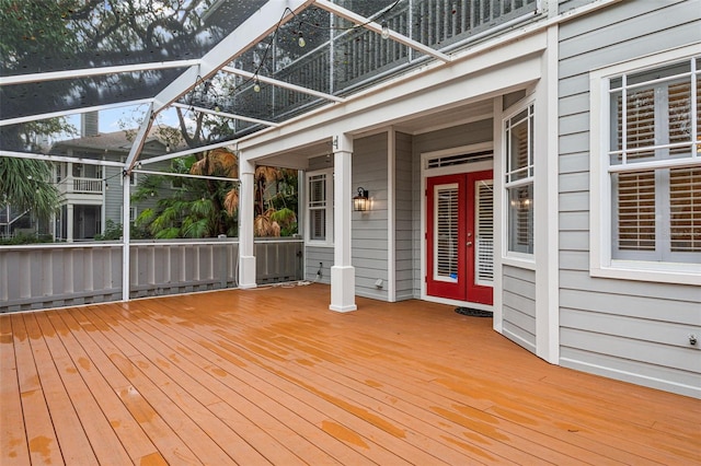 wooden terrace featuring a lanai