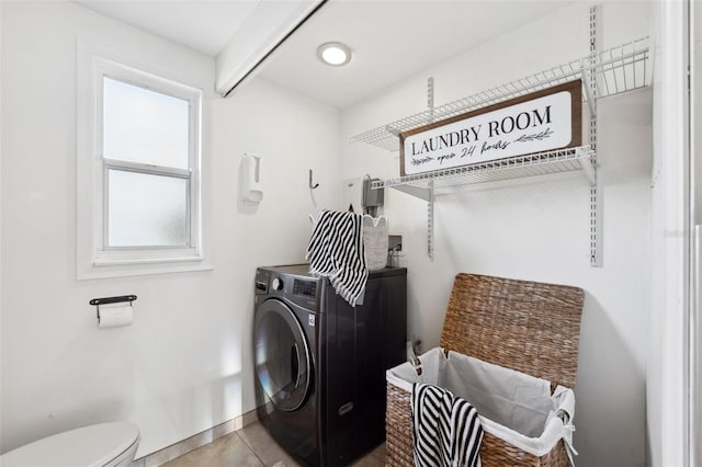 washroom with light tile patterned flooring and washer / clothes dryer