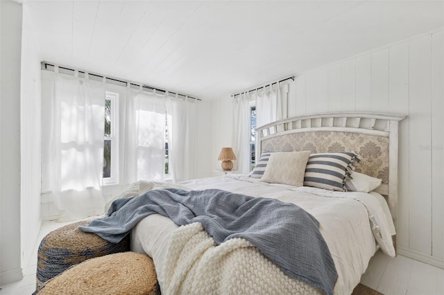 bedroom with wooden walls