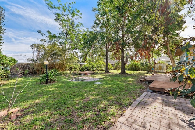 view of yard featuring a wooden deck