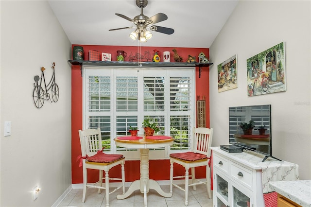 tiled dining area featuring ceiling fan