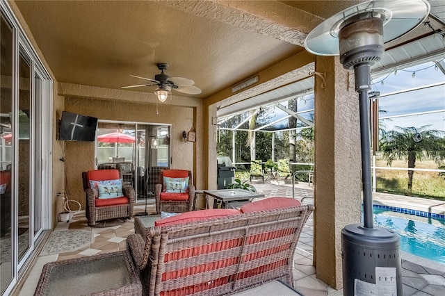 view of patio featuring ceiling fan, a grill, and a lanai