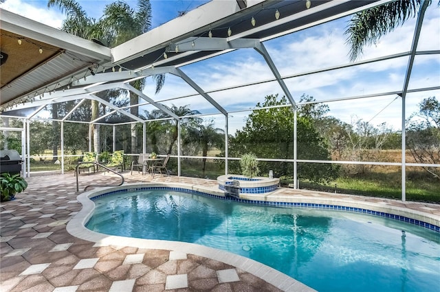 view of pool with a patio and a lanai