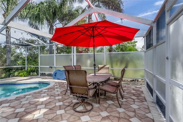 view of patio / terrace with a lanai