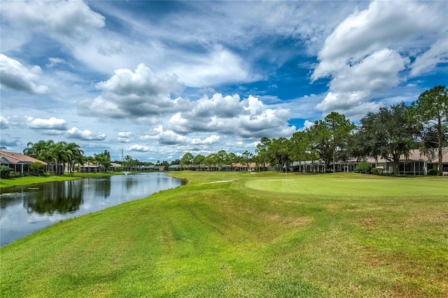 view of home's community featuring a yard and a water view