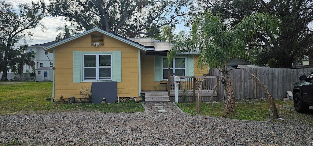 bungalow-style house with solar panels