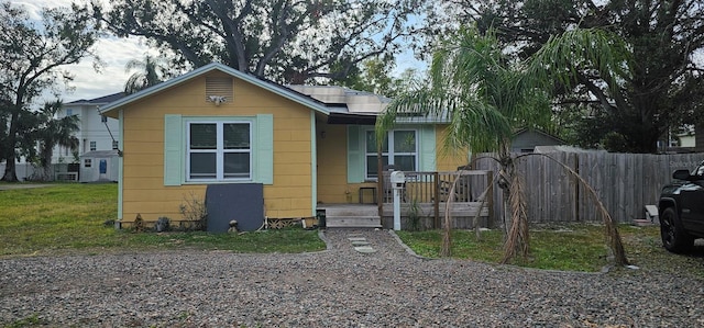 bungalow-style house with solar panels