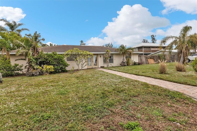 ranch-style house with a front yard