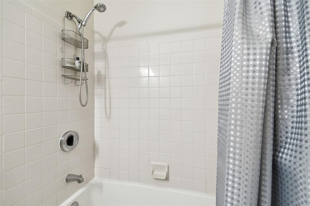 bathroom with shower / bath combo with shower curtain