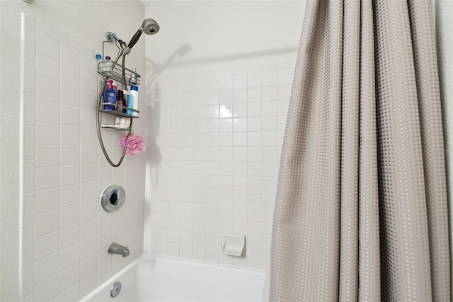 bathroom featuring shower / bathtub combination with curtain