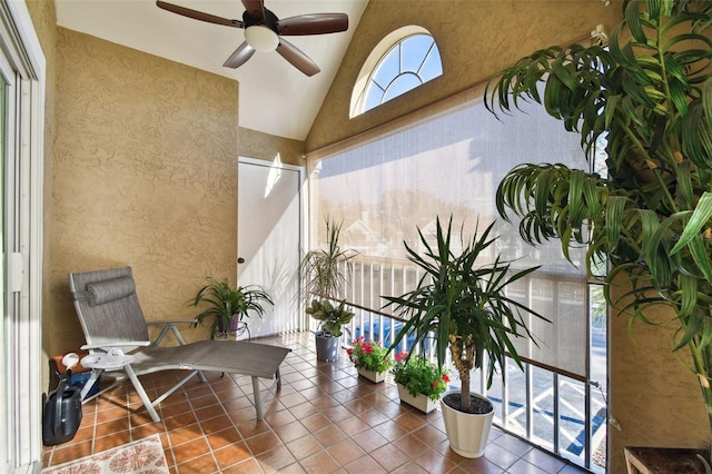 interior space featuring ceiling fan and lofted ceiling