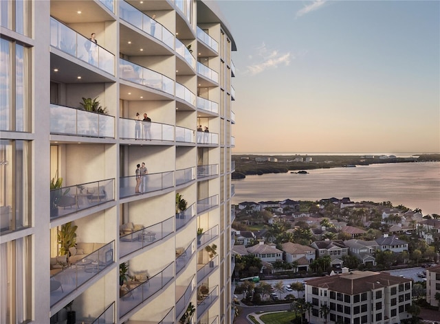 outdoor building at dusk featuring a water view