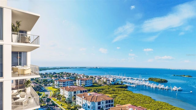 birds eye view of property with a water view