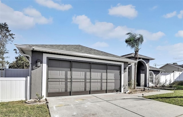 ranch-style house featuring a garage and a front yard