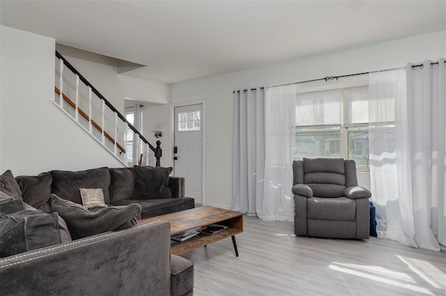 living room with light hardwood / wood-style flooring